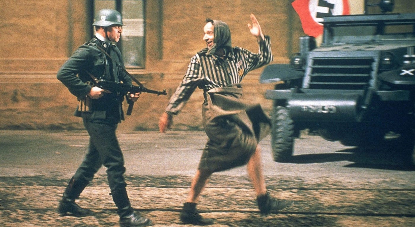 Still from the film Life Is Beautiful showing the father Guido with his son Giosuè.