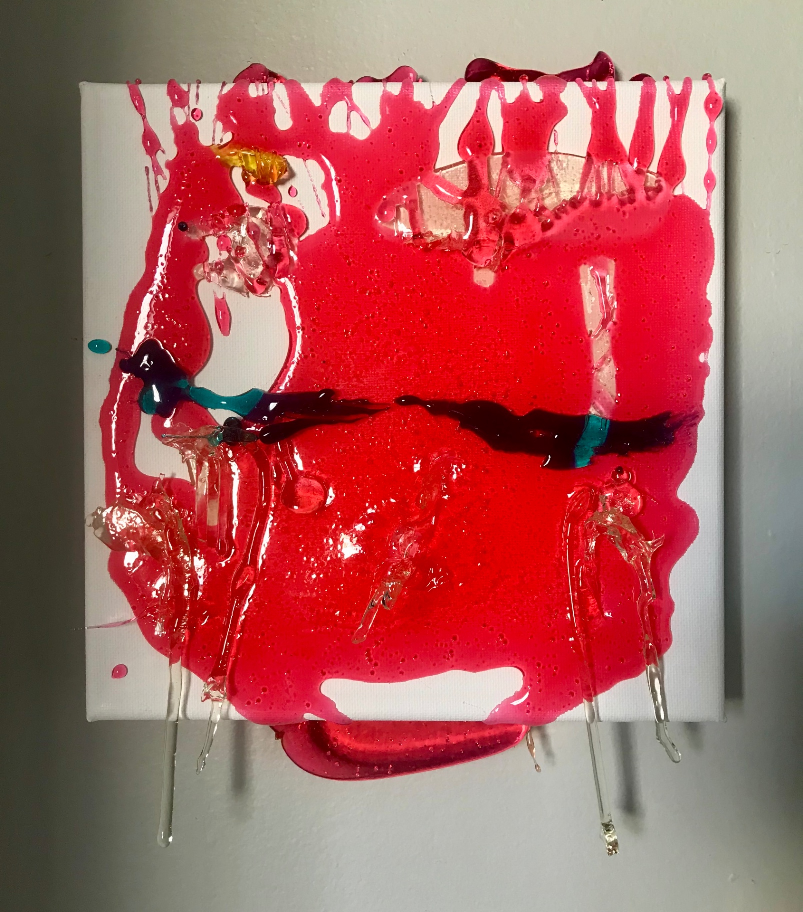 Candying canvas (red), 2018 — poured red candy on white canvas with translucent drips and a black-teal accent, by Hannes Bend