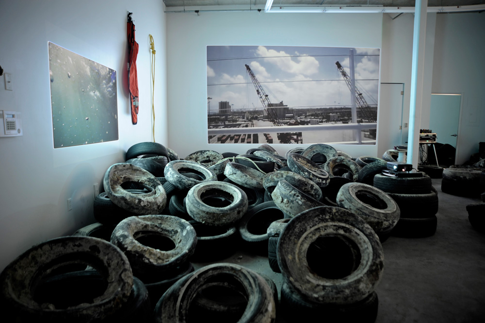 ECLIPSE installation view — salvaged tires arranged in the gallery, 2012