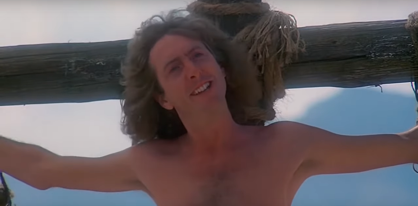 Final scene of Monty Python's Life of Brian, with rows of crucified figures singing on a hillside.