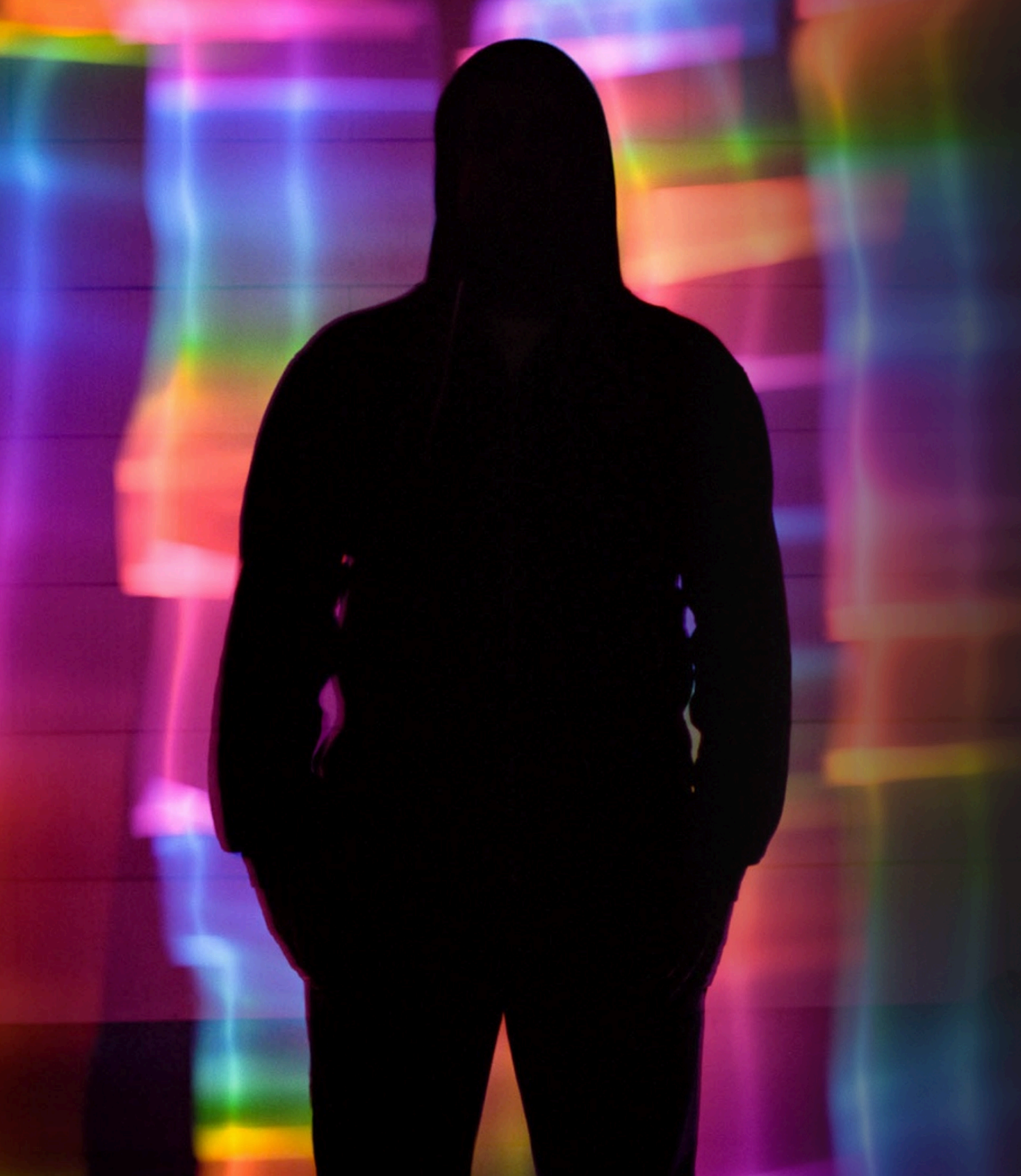 Archival image from the 2020 Heaven or Hell proposal — a silhouetted figure against a field of blurred coloured light streaks