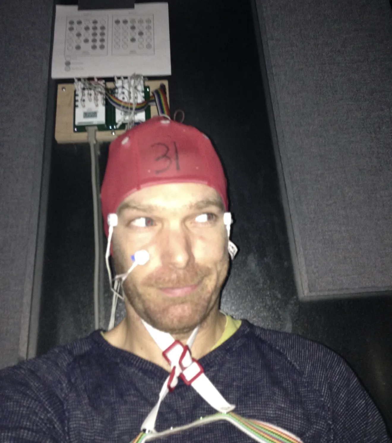 Hannes Bend wearing a wired EEG electrode cap during research at the University of Oregon.
