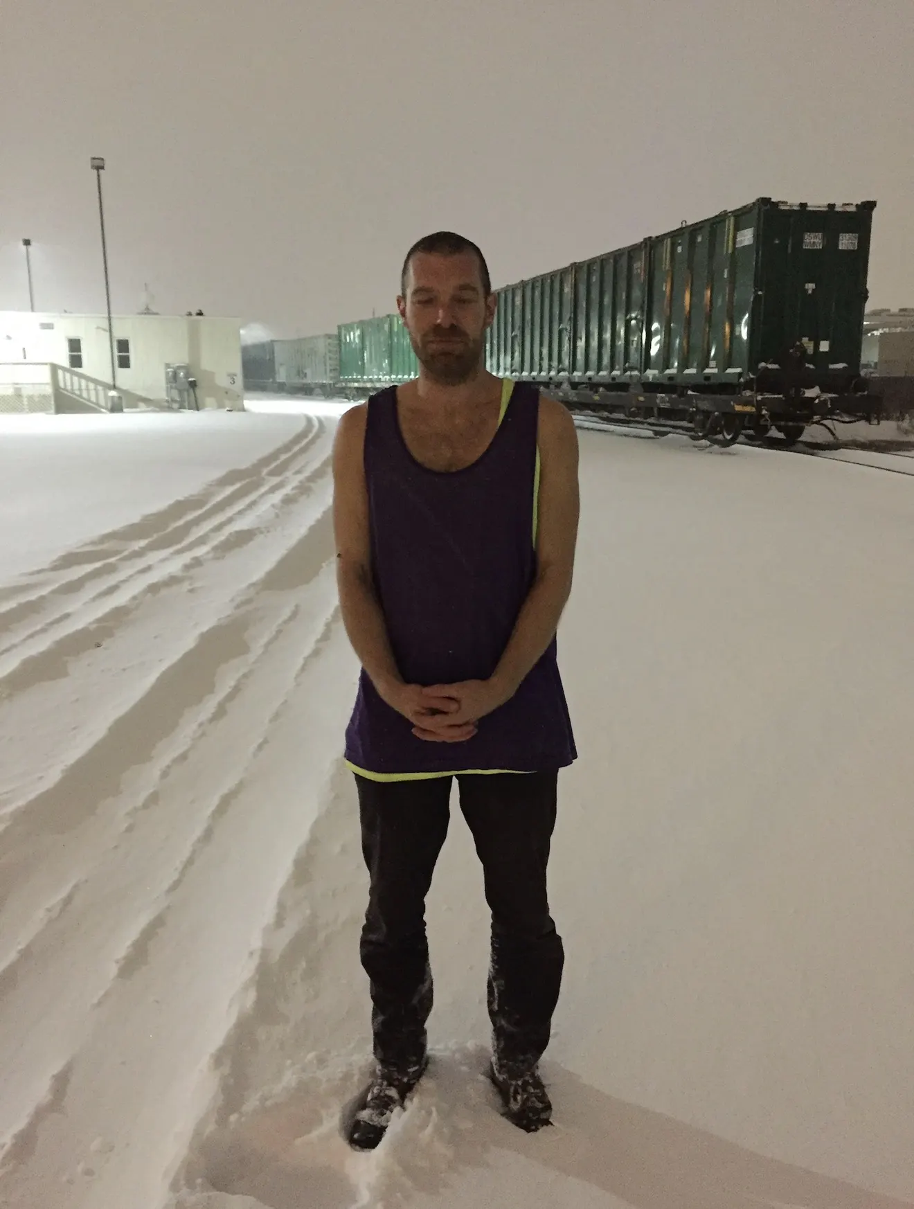 Hannes Bend practising cold exposure in deep snow at an industrial railyard, Long Island City, New York, winter 2017.